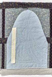 A quilted picture of Helen Barre, kneeling under an arch and holding a book. A strip of fabric with text attached falls from the book. 
